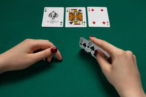 The dealer puts three cards face up on the board, known as the flop. After a round of betting, a fourth card (the turn) is dealt. Another round of betting occurs before the fifth and final card (the river) is dealt. The river is followed by one final round of betting.